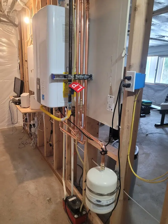 Licensed plumber repairing a kitchen sink in Mill Bay